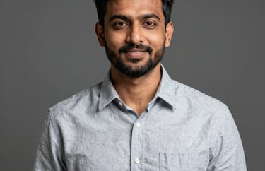 Professional studio portrait of a South Asian / Indian male community organizer, with a modern and clean aesthetic.