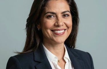 Professional headshot of a South American / Brazilian female lawyer, smiling confidently, soft Pale Azure lighting.