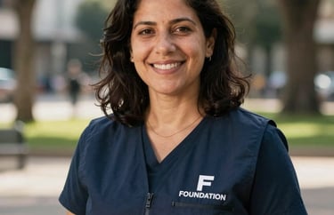 Portrait of a social work coordinator in an outdoor urban park setting. Wearing a professional vest with the foundation logo. Warm natural lighting. Global / Spanish-speaking.