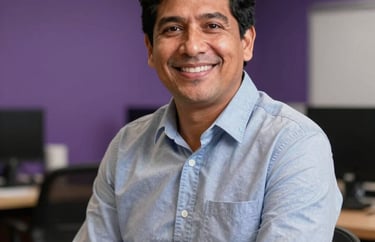 Portrait of a friendly South American consultant in a purple-toned office, looking professional and welcoming.
