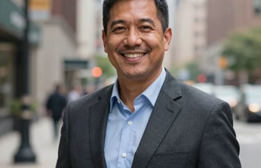 A professional portrait of a community liaison in a North American city setting, smiling warmly, wearing business casual attire, soft bokeh background.