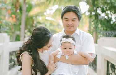 Mother holding baby in close moment during family photography session at Sofitel Nusa Dua Bali