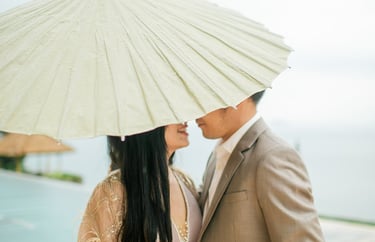 Elegant prewedding couple under Balinese umbrella at Amankila Karangasem Bali