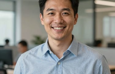 Professional headshot of a male outreach coordinator, smiling, North American office setting, modern professional style.