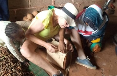 Tourist learning traditional basket knitting from local artisans during an authentic Zanzibar village tour