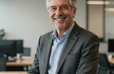A professional portrait of a senior insurance advisor in a modern US office, dressed in business casual attire, smiling warmly to convey trust and reliability.