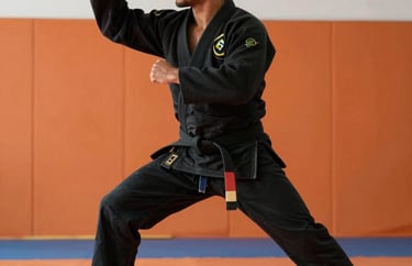 A Brazilian male martial arts instructor in a black gi, showing a disciplined and inspiring posture in a gym setting with orange accents.