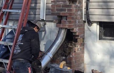 "Profaster installing a steel flue liner in a chimney in Des Moines, IA."