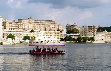 Boat ride on Lake Pichhola with City Palace Udaipur in the background.