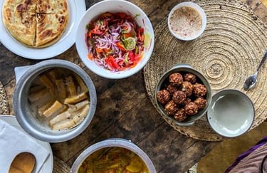 Visitors cooking and tasting traditional Zanzibari local dishes during a cooking class on a Zanzibar spice tour