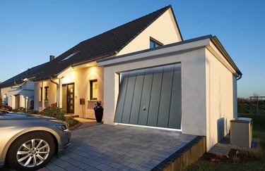front of a house showing a grey garage door