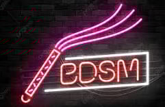 a neon sign with BDSM