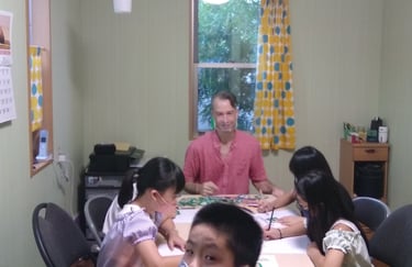 students and teacher in a home classroom
