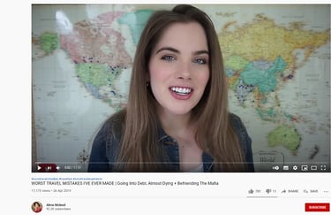 a woman with a smile on her face and a map of the world