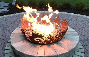 Leppek Landscapes custom fire pit and fire bowl on patio. 