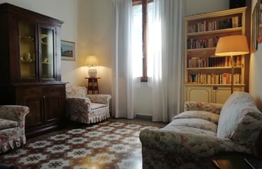 a living room with a couch and chairs
