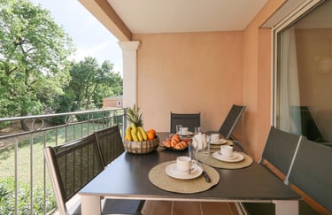 a table with a bowl of fruit on it