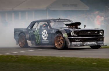 Ken Block drifting his Hoonicorn with the Duke of Richmond at the Goodwood Festival of Speed
