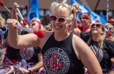 Batala Band team member in action