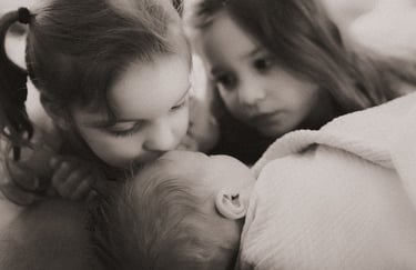 Sibling newborn photo with two sisters and baby brother, Duluth Minnesota