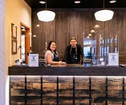 dispensary staff helping fix an order issue