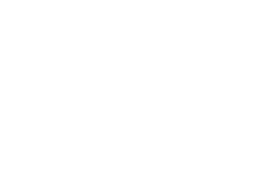 a dog is standing in front of a white square sign