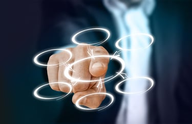 A man touching a transparent screen
