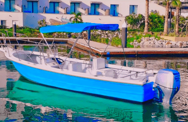 a boat in the water with a blue sky in the background