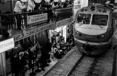Hanoi Train Street black and white night photography train passing narrow street