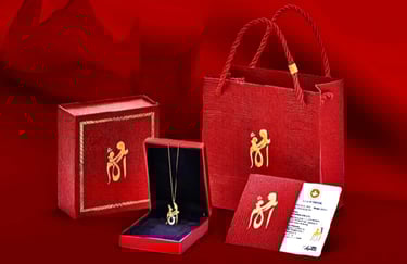 a red gift box with a gold necklace and a necklace