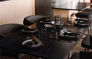 An image of a dining table with pace servings shown in rendered view on the computer in Blander.