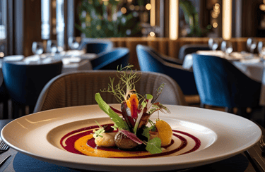 a plate of food and a glass of wine in a restaurant