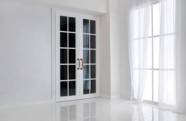 a white door with a glass door and a window