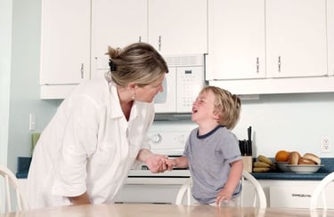 Mother comforts her son