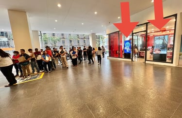 alt="digital advertising outside visa processing center waiting area"