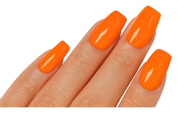 a woman's hand with a bright orange press on nails