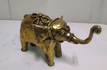 "Glossy brass baby elephant with tribal design carvings, right side view-for foreign markets"