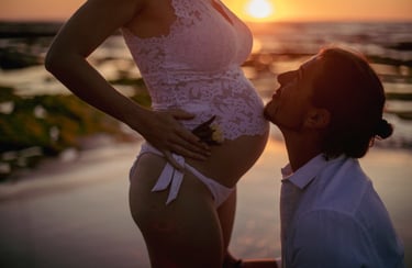 a pregnant woman is standing in front of a man