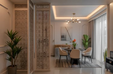 Gold-toned jaali dividing the entryway and living room