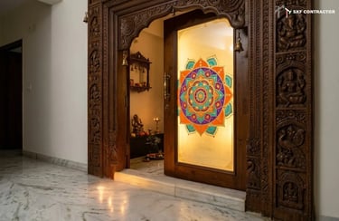 Carved wooden temple door with a colorful mandala glass panel leading into a traditional Hindu puja room.