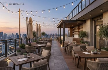 Modern luxury rooftop terrace bar with outdoor seating and string lights overlooking a city skyline at sunset.