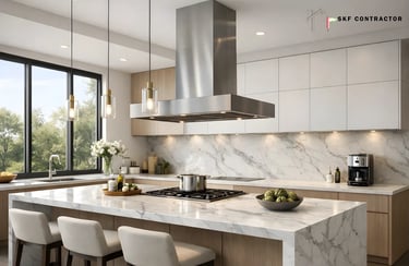 Modern luxury kitchen featuring a marble island with gas cooktop, stainless steel range hood, and white cabinetry.