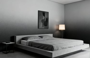 Modern minimalist bedroom with a grey platform bed, abstract wall art, and a glowing floor lamp.
