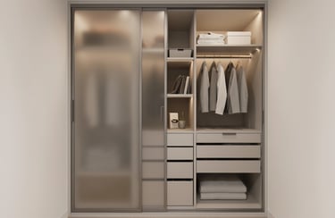 Modern custom wardrobe with frosted glass sliding doors, built-in LED lighting, and organized storage shelves.