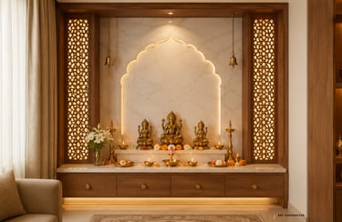 Modern Hindu prayer room with wooden jali panels, marble backdrop, and golden deity statues for home mandir design.