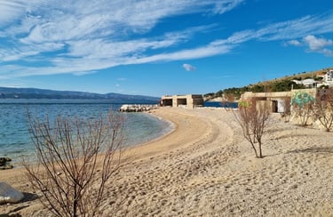 The photograph shows the central area of Rape Beach, one of the top beaches in Croatia.