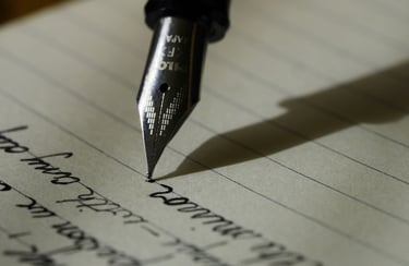 Close-up of a Pilot fountain pen nib writing cursive text on lined paper.