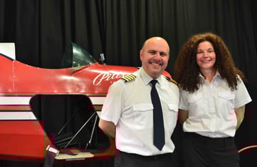 two people and a plane fuselage 