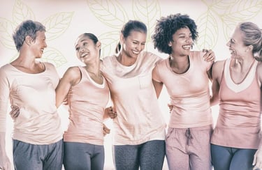 a group of women in pink shirts and pants