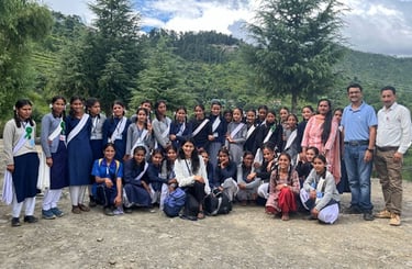 Group or schoolgirls outside with Ambassador Pooja C.